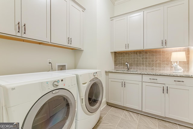 1911 Bent Pine Park, Statham, GA 30666 - laundry area featuring washer and clothes dryer, cabinet space, and light tile patterned flooring