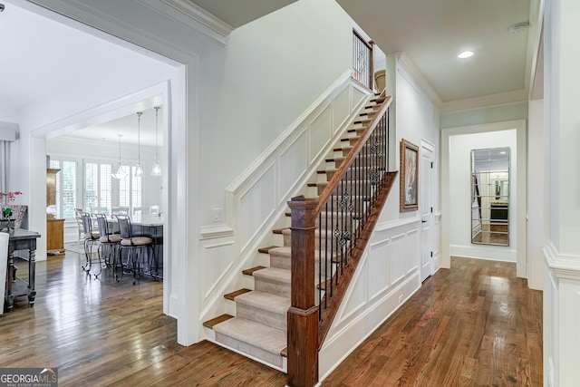 1911 Bent Pine Park, Statham, GA 30666 - staircase featuring wood finished floors, ornamental molding, a chandelier, and recessed lighting
