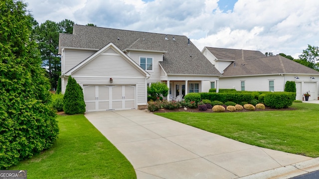 1911 Bent Pine Park, Statham, GA 30666 - traditional-style home featuring driveway, a front lawn, and roof with shingles