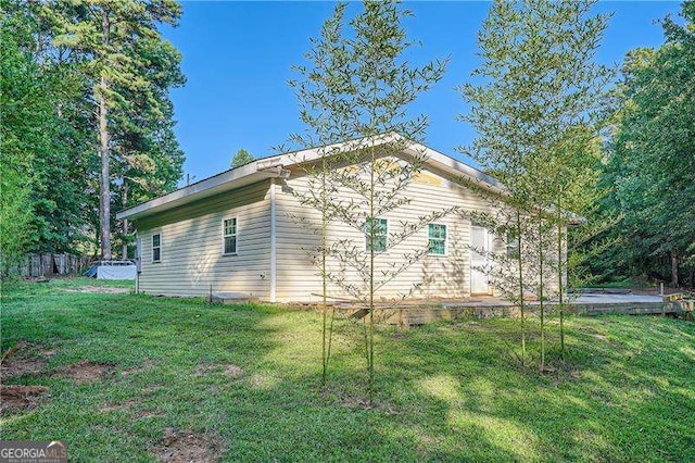 1565 Dr Bramblett Rd, Cumming, GA 30028 - view of side of property featuring a yard