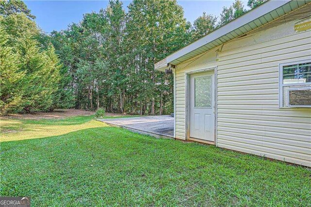 1565 Dr Bramblett Rd, Cumming, GA 30028 - view of green lawn with a wooden deck