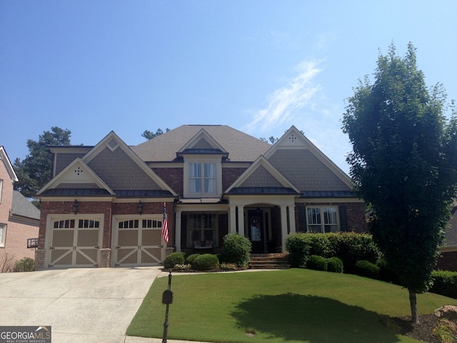 4050 Bonnett Creek Ln, Hoschton, GA 30548 - craftsman inspired home featuring a standing seam roof, driveway, a front yard, and a metal roof