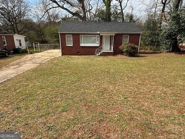 1883 Clarke Ln, Decatur, GA 30035 - view of front of home featuring brick siding, driveway, crawl space, and roof with shingles