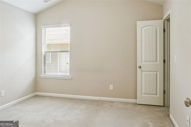 2638 Lake Manor Cir, Duluth, GA 30096 - spare room featuring vaulted ceiling and light carpet