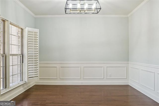 2638 Lake Manor Cir, Duluth, GA 30096 - unfurnished dining area with a chandelier, crown molding, dark wood-style floors, and wainscoting