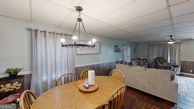 15 Aragon Rd, Aragon, GA 30104 - dining space with a wainscoted wall, wood-type flooring, a drop ceiling, ceiling fan, and wooden walls