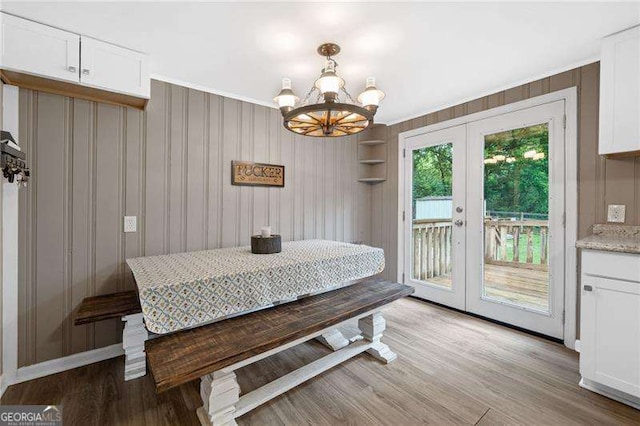 154 Fairview Rd, Ball Ground, GA 30107 - dining space with french doors, light wood-style flooring, and a chandelier