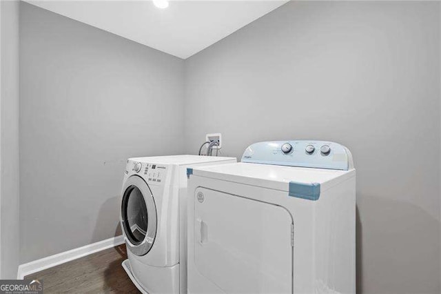 154 Fairview Rd, Ball Ground, GA 30107 - laundry area featuring washing machine and clothes dryer and wood finished floors