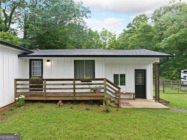 154 Fairview Rd, Ball Ground, GA 30107 - rear view of property with board and batten siding, roof with shingles, and a deck