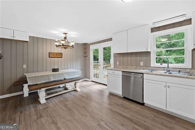 154 Fairview Rd, Ball Ground, GA 30107 - kitchen featuring dishwasher, french doors, white cabinetry, a chandelier, and wood finished floors