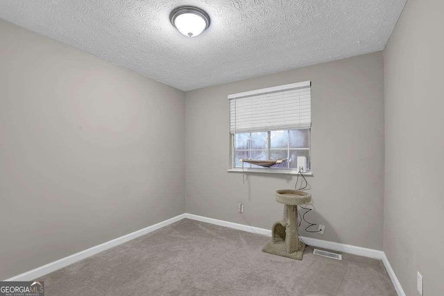 1066 Wedgewood Ln, Tucker, GA 30084 - spare room with a textured ceiling and carpet floors