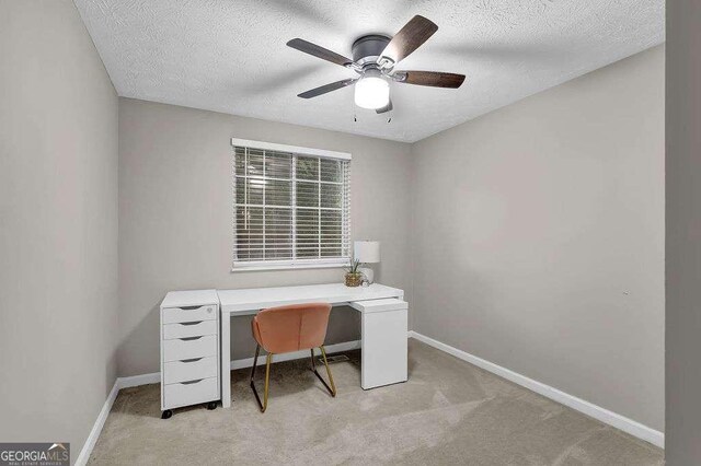 1066 Wedgewood Ln, Tucker, GA 30084 - home office featuring ceiling fan, light carpet, and a textured ceiling