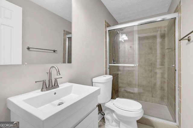 1066 Wedgewood Ln, Tucker, GA 30084 - full bathroom featuring vanity, a stall shower, and a textured ceiling