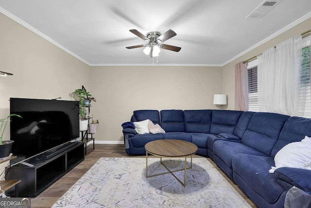 1066 Wedgewood Ln, Tucker, GA 30084 - living area with wood finished floors, ceiling fan, and crown molding
