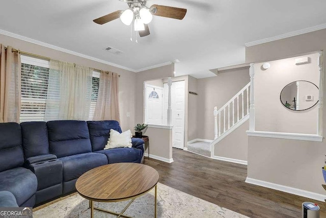 1066 Wedgewood Ln, Tucker, GA 30084 - living area with wood finished floors, ceiling fan, stairs, and crown molding