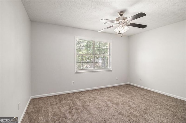 3440 Oaktree, Stonecrest, GA 30038 - spare room with carpet, a textured ceiling, and a ceiling fan