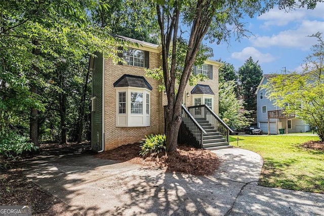 3440 Oaktree, Stonecrest, GA 30038 - view of front of property featuring brick siding, a front lawn, and stairs