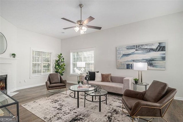 3440 Oaktree, Stonecrest, GA 30038 - living area featuring wood finished floors, a ceiling fan, and a tiled fireplace