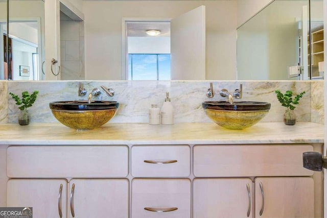 2575 Peachtree Rd NE Unit 15G, Atlanta, GA 30305 - full bathroom featuring double vanity and tasteful backsplash