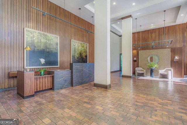 2575 Peachtree Rd NE Unit 15G, Atlanta, GA 30305 - community lobby featuring a high ceiling, wooden walls, and recessed lighting