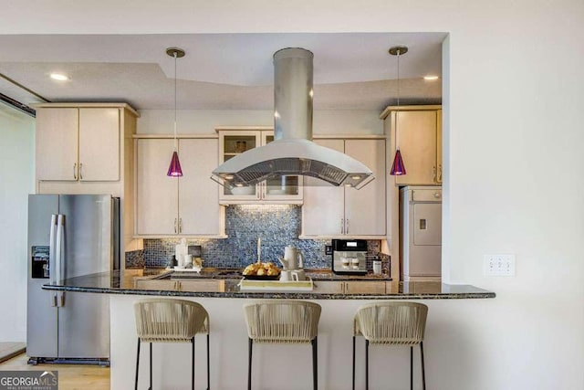 2575 Peachtree Rd NE Unit 15G, Atlanta, GA 30305 - kitchen featuring stainless steel fridge with ice dispenser, island exhaust hood, fridge, decorative backsplash, and dark stone countertops