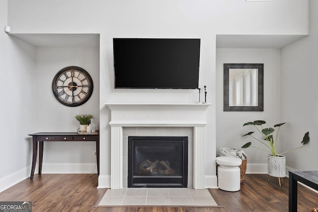 2767 NW Magnolia Creek Dr, Kennesaw, GA 30152 - detailed view of a tile fireplace and wood finished floors