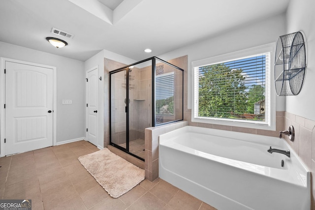 2767 NW Magnolia Creek Dr, Kennesaw, GA 30152 - bathroom with a garden tub, a shower stall, and tile patterned flooring