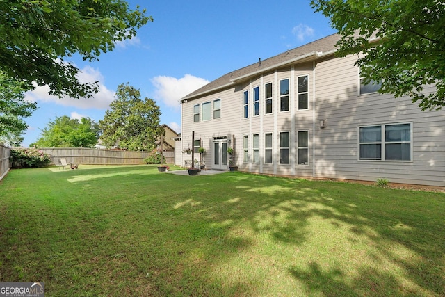 2767 NW Magnolia Creek Dr, Kennesaw, GA 30152 - rear view of house featuring a fenced backyard and a patio area