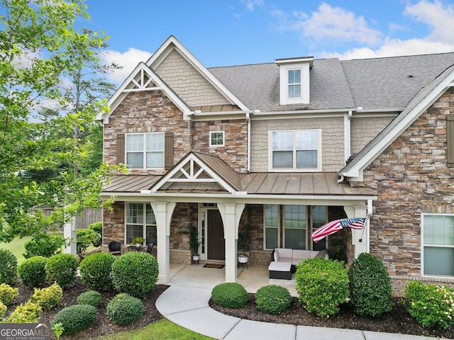 2767 NW Magnolia Creek Dr, Kennesaw, GA 30152 - craftsman house featuring a standing seam roof, a porch, stone siding, and roof with shingles