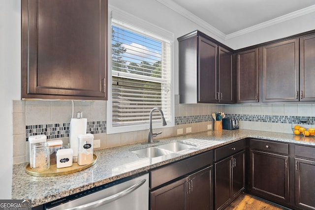 2767 NW Magnolia Creek Dr, Kennesaw, GA 30152 - kitchen with stainless steel dishwasher, dark brown cabinetry, light stone counters, crown molding, and backsplash