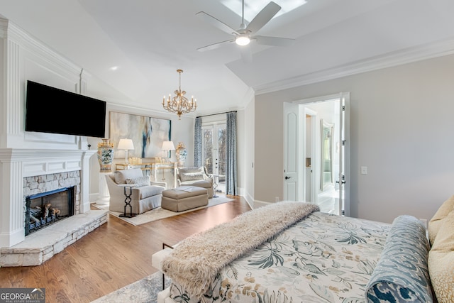 6226 Random Winds Blf, Gainesville, GA 30506 - bedroom featuring wood finished floors, a chandelier, a fireplace, crown molding, and vaulted ceiling