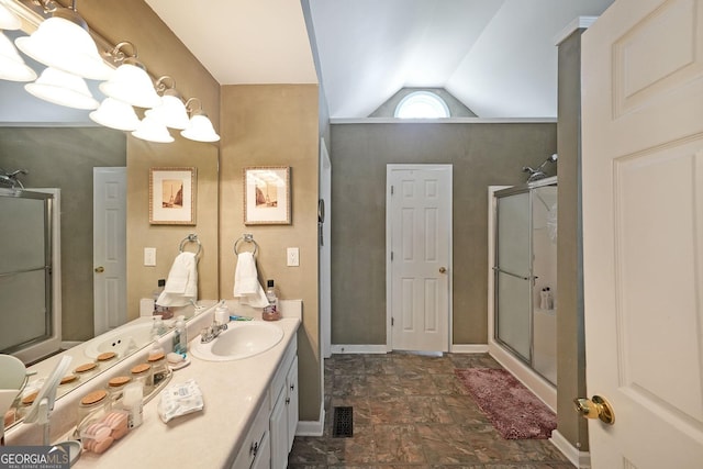 443 Brooks Rd, Dallas, GA 30132 - bathroom featuring a shower stall, stone finish flooring, lofted ceiling, and vanity