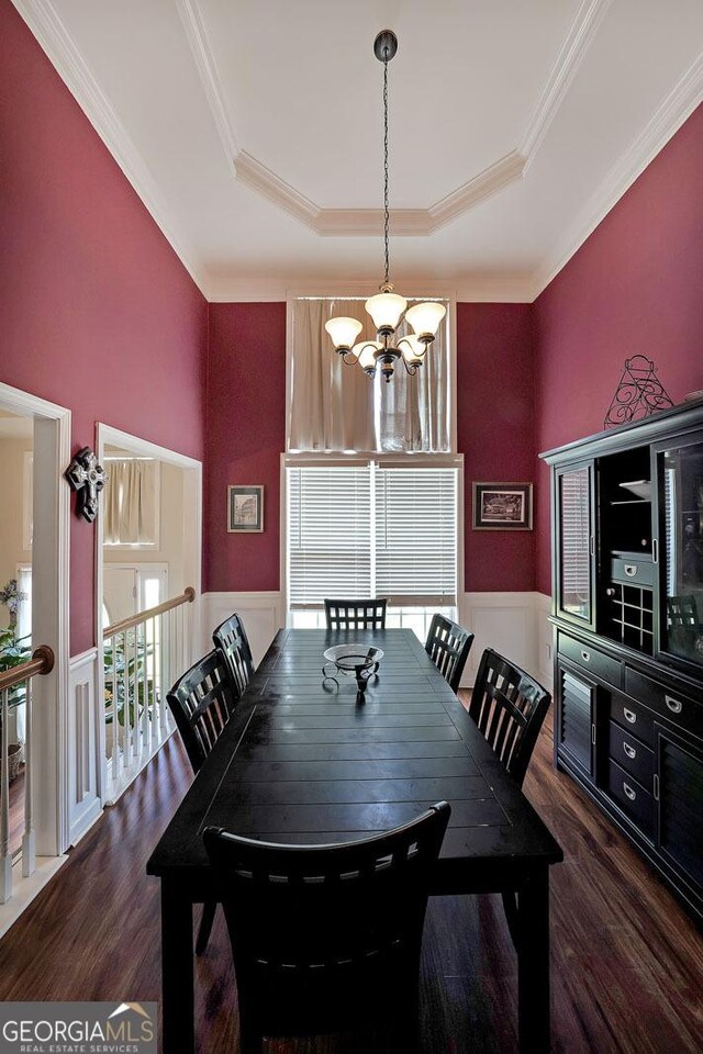 443 Brooks Rd, Dallas, GA 30132 - dining space featuring a chandelier, a raised ceiling, wood finished floors, and crown molding