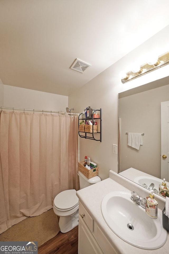 443 Brooks Rd, Dallas, GA 30132 - bathroom featuring vanity, wood finished floors, and curtained shower