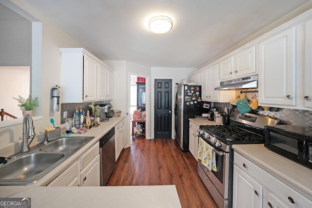 443 Brooks Rd, Dallas, GA 30132 - kitchen featuring appliances with stainless steel finishes, under cabinet range hood, white cabinetry, and tasteful backsplash