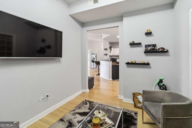 390 17th St NW Unit 6055, Atlanta, GA 30363 - sitting room featuring light wood-style floors and baseboards