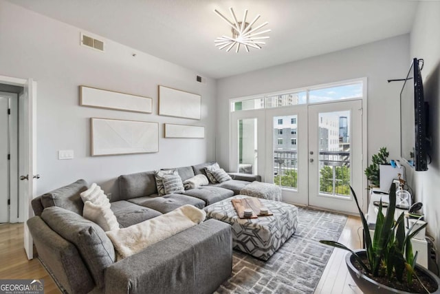 390 17th St NW Unit 6055, Atlanta, GA 30363 - living room featuring french doors and wood finished floors