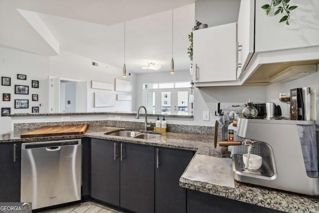 390 17th St NW Unit 6055, Atlanta, GA 30363 - kitchen featuring dishwasher, dark cabinets, and dark stone counters