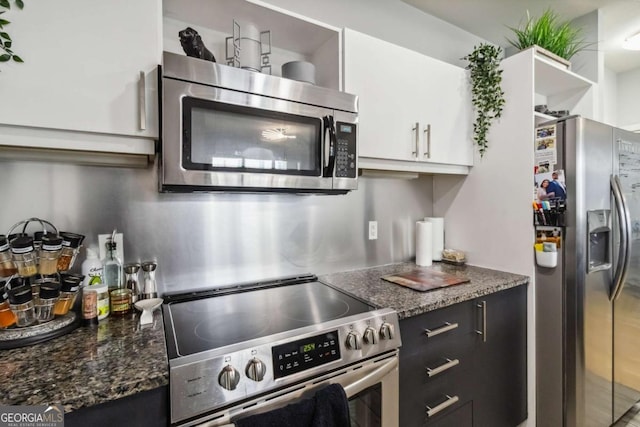 390 17th St NW Unit 6055, Atlanta, GA 30363 - kitchen with appliances with stainless steel finishes, white cabinetry, dark stone counters, and open shelves
