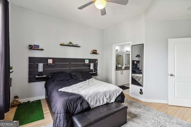 390 17th St NW Unit 6055, Atlanta, GA 30363 - bedroom with wood finished floors, a ceiling fan, and ensuite bathroom