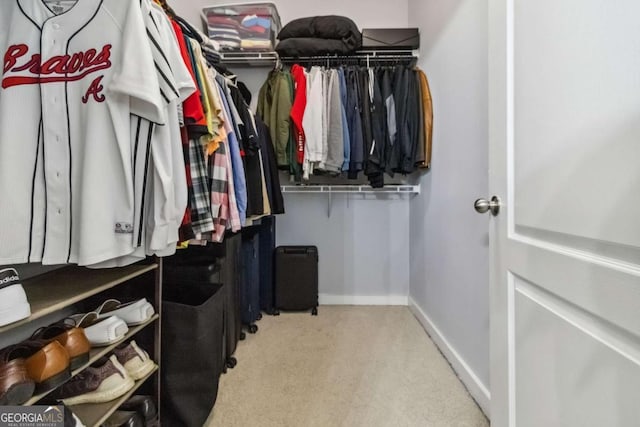 390 17th St NW Unit 6055, Atlanta, GA 30363 - walk in closet featuring light carpet