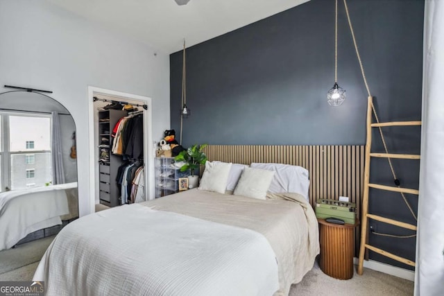 390 17th St NW Unit 6055, Atlanta, GA 30363 - bedroom featuring carpet flooring, a closet, and a walk in closet