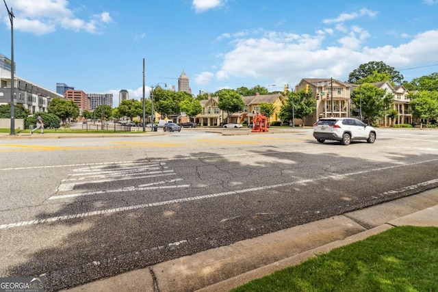 390 17th St NW Unit 6055, Atlanta, GA 30363 - view of asphalt road with curbs, sidewalks, and street lights
