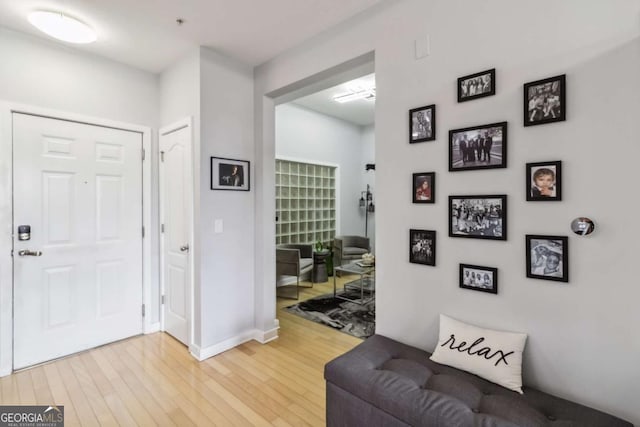390 17th St NW Unit 6055, Atlanta, GA 30363 - foyer entrance with light wood-style floors and baseboards