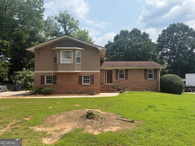 2206 Rhett Ct, Lawrenceville, GA 30044 - split level home featuring a front yard, brick siding, and crawl space