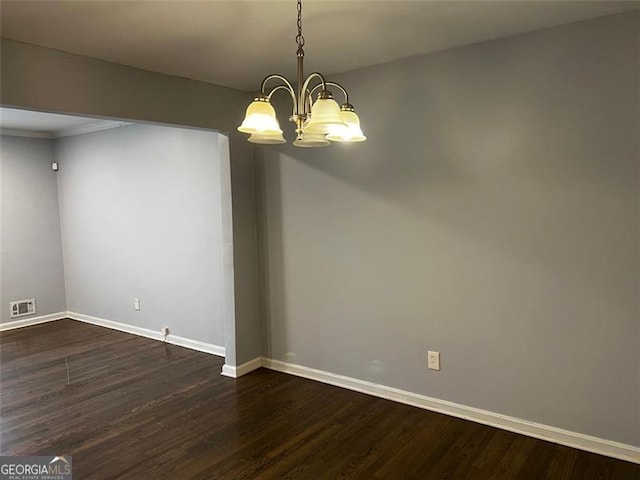 2436 Glenrock Dr, Decatur, GA 30032 - spare room with a chandelier and dark wood finished floors