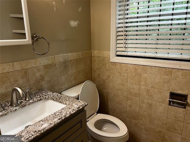 2436 Glenrock Dr, Decatur, GA 30032 - bathroom with tile walls, plenty of natural light, vanity, and wainscoting