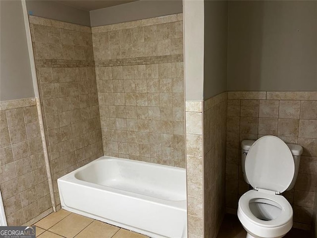 2436 Glenrock Dr, Decatur, GA 30032 - full bath with tile walls, tile patterned floors, wainscoting, and shower / tub combination