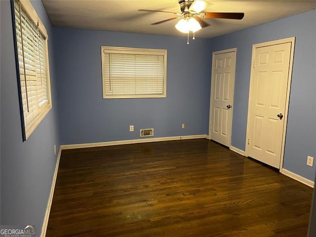 2436 Glenrock Dr, Decatur, GA 30032 - unfurnished bedroom featuring dark wood finished floors and a ceiling fan