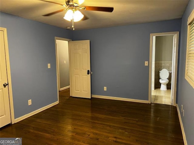 2436 Glenrock Dr, Decatur, GA 30032 - unfurnished bedroom with wood finished floors, connected bathroom, and a ceiling fan